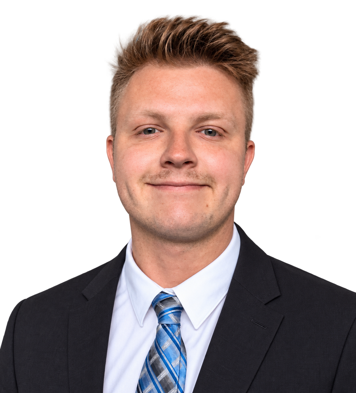 Henry Simpson wearing a dark suit and blue tie